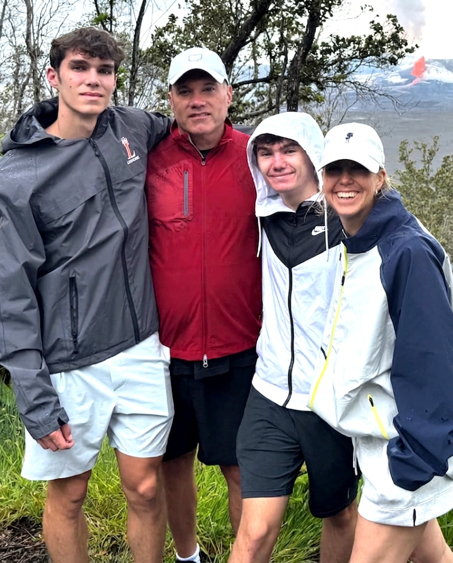Diane, founder of The Wellness Basket, with her husband and two sons on a hike in Hawaii
